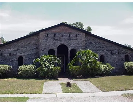 a front view of a house with yard