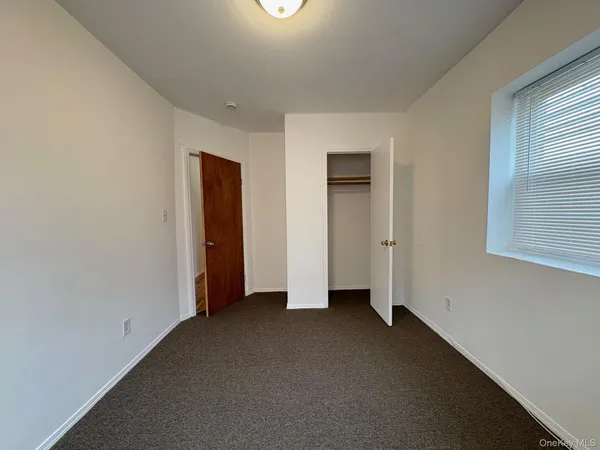 a view of a bathroom from a hallway