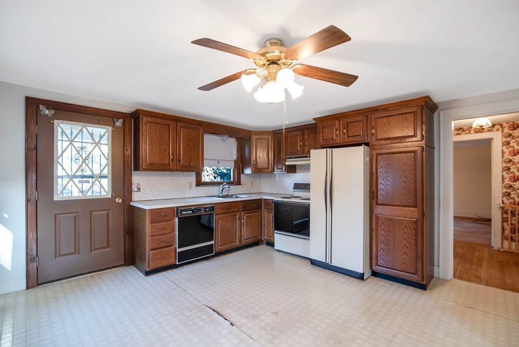 582 Springfield Street Feeding Hills, MA 01030 - Photo 11 of 42 a kitchen with a refrigerator and a sink
