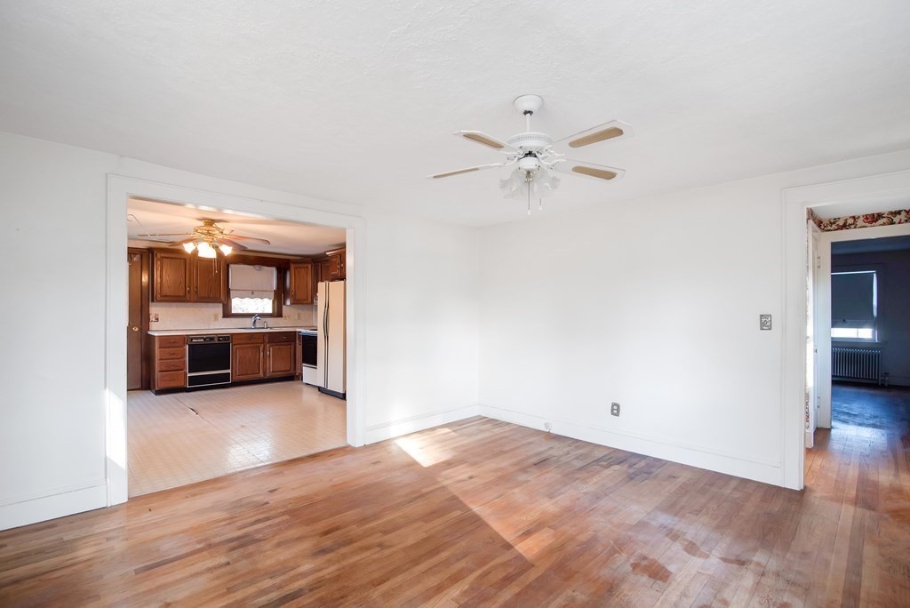 582 Springfield Street Feeding Hills, MA 01030 - Photo 12 of 42 a view of a room with wooden floor and a ceiling fan