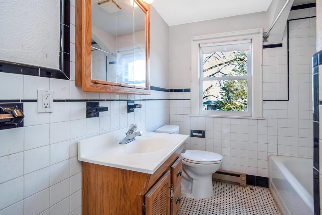 582 Springfield Street Feeding Hills, MA 01030 - Photo 15 of 42 a bathroom with a sink a toilet and bathtub