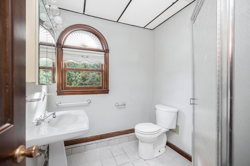 582 Springfield Street Feeding Hills, MA 01030 - Photo 20 of 42 a bathroom with a toilet sink and mirror