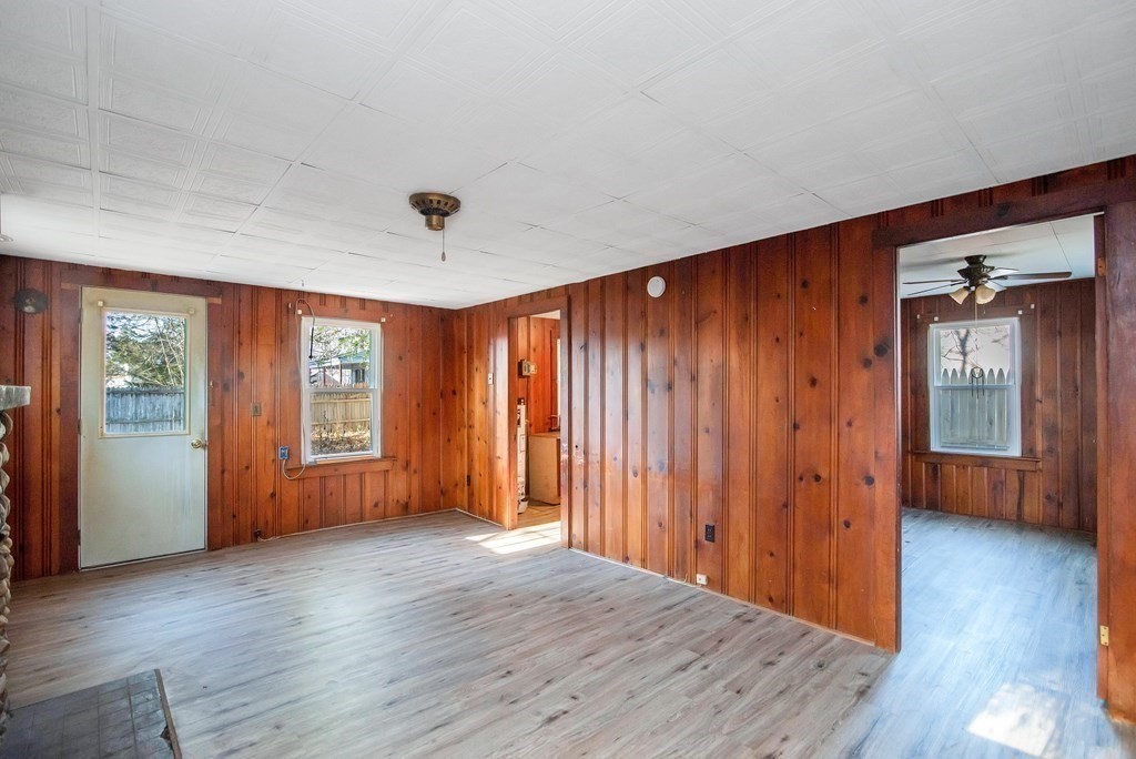 582 Springfield Street Feeding Hills, MA 01030 - Photo 23 of 42 an empty room with wooden floor and windows
