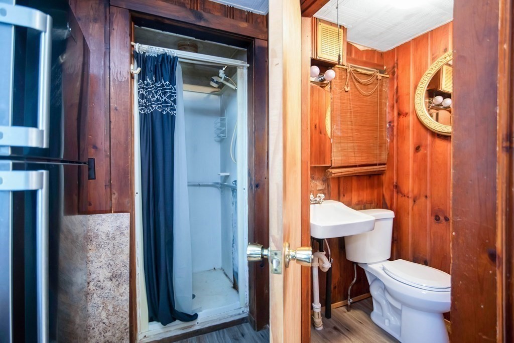 582 Springfield Street Feeding Hills, MA 01030 - Photo 27 of 42 a bathroom with a toilet a sink and shower