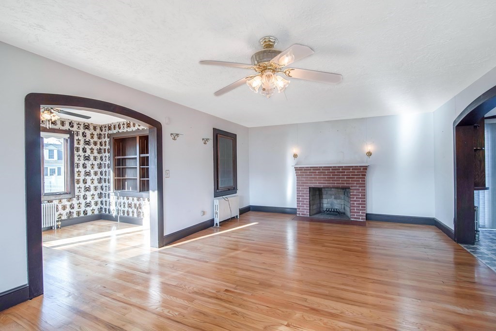 582 Springfield Street Feeding Hills, MA 01030 - Photo 4 of 42 a view of an empty room with wooden floor and a window