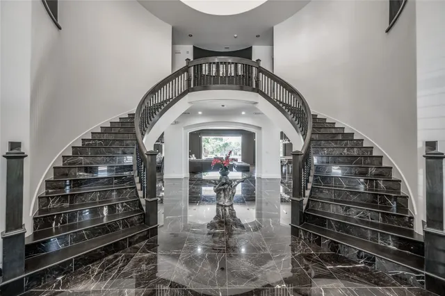a view of staircase with wooden floor