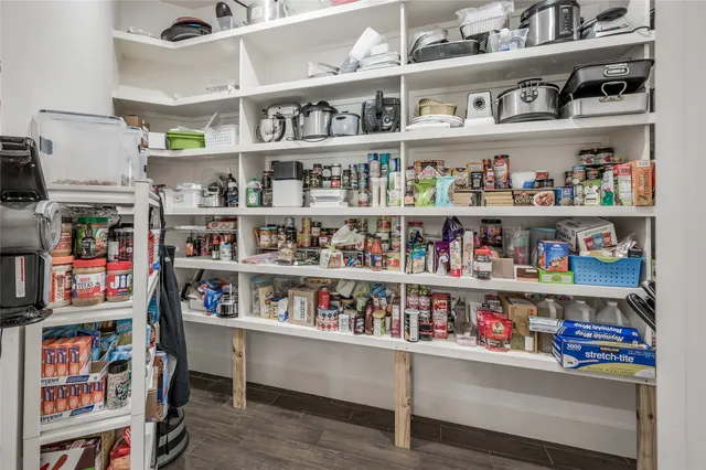 a kitchen with stainless steel appliances granite countertop a refrigerator and a stove