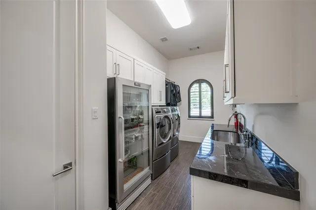 a bathroom with a granite countertop sink a toilet and a mirror