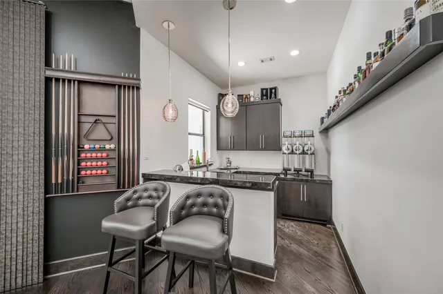 a large kitchen with a table and chairs