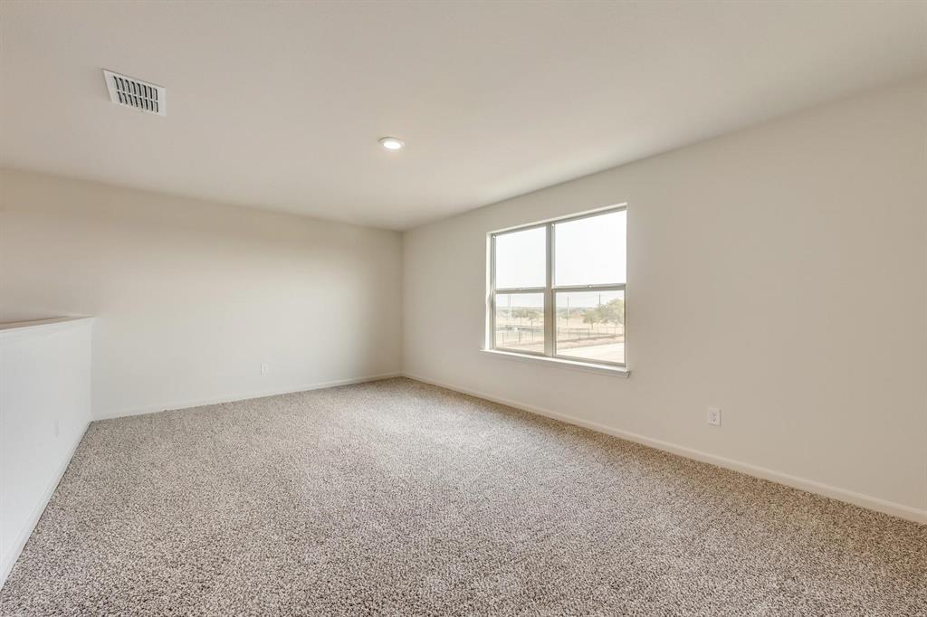 8126 Big Timber Trail Ponder, TX 76259 - Photo 10 of 16 an empty room with a window