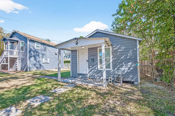 a view of house with yard