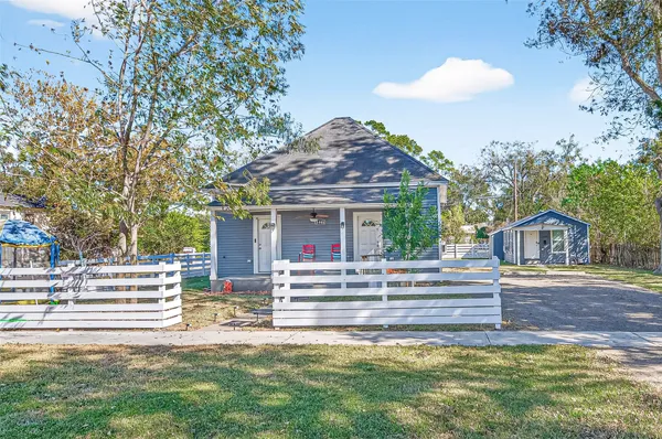 a view of a house with a yard porch and sitting area