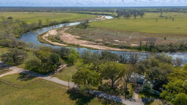 a view of a lake with a yard