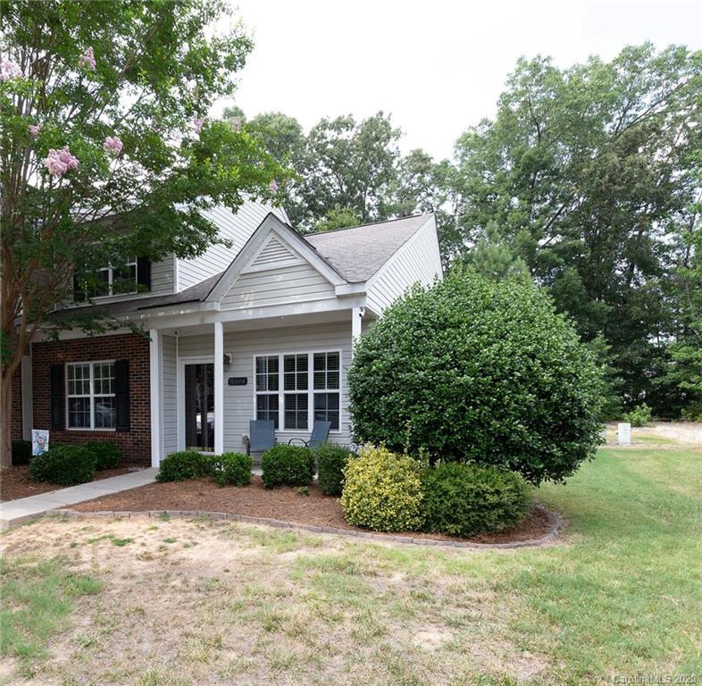8304 Rudolph Road Charlotte, NC 28216 - Photo 2 of 17 a view of a house with a yard and potted plants