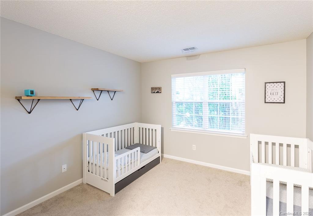 8304 Rudolph Road Charlotte, NC 28216 - Photo 12 of 17 a view of an empty room with a window