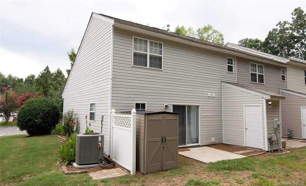 8304 Rudolph Road Charlotte, NC 28216 - Photo 16 of 17 a view of a small house with yard