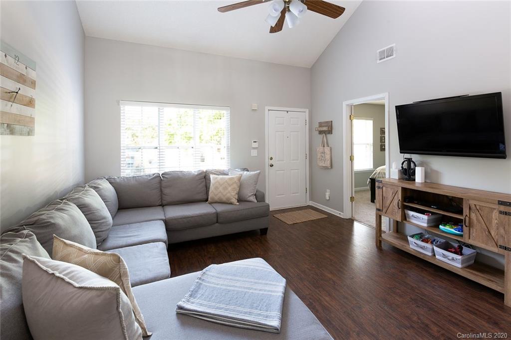 8304 Rudolph Road Charlotte, NC 28216 - Photo 4 of 17 a living room with furniture and a flat screen tv