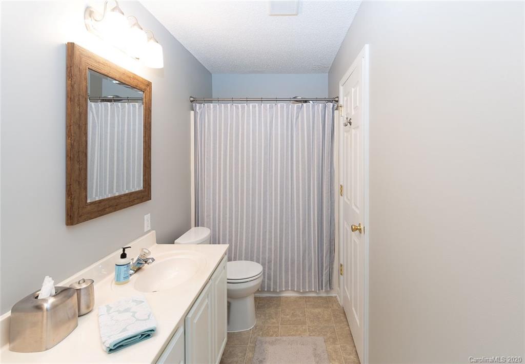 8304 Rudolph Road Charlotte, NC 28216 - Photo 7 of 17 a bathroom with a sink toilet and vanity