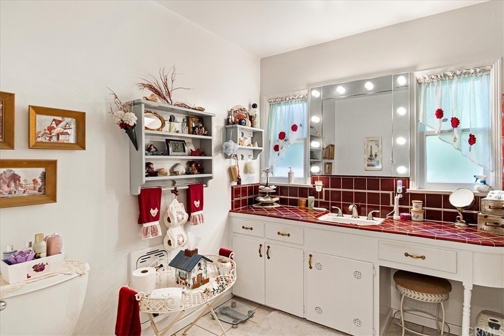 876 North 1st Avenue Upland, CA 91786 - Photo 12 of 30 a bathroom with a sink mirror and window