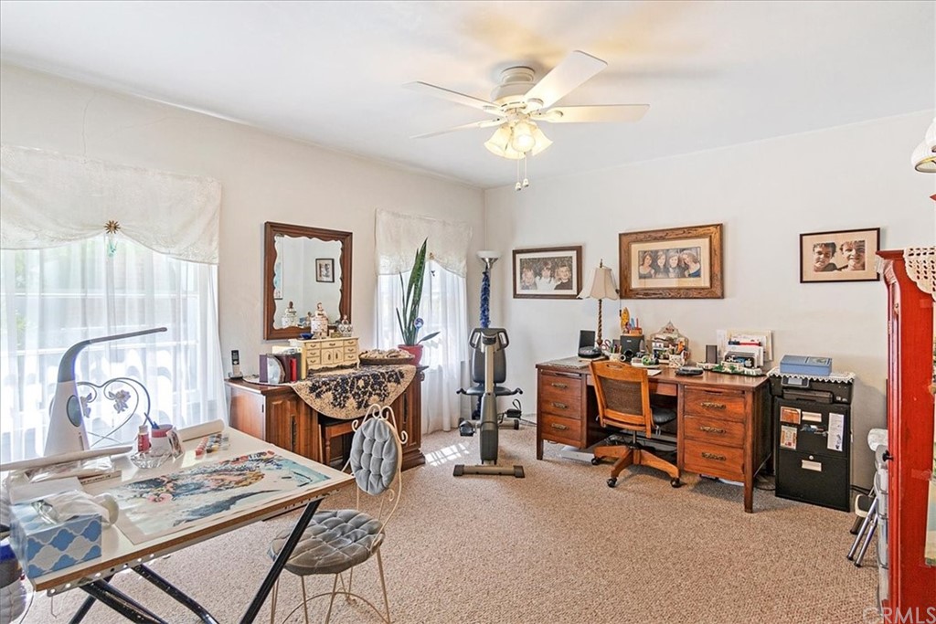 876 North 1st Avenue Upland, CA 91786 - Photo 13 of 30 a living room with furniture a flat screen tv and a window