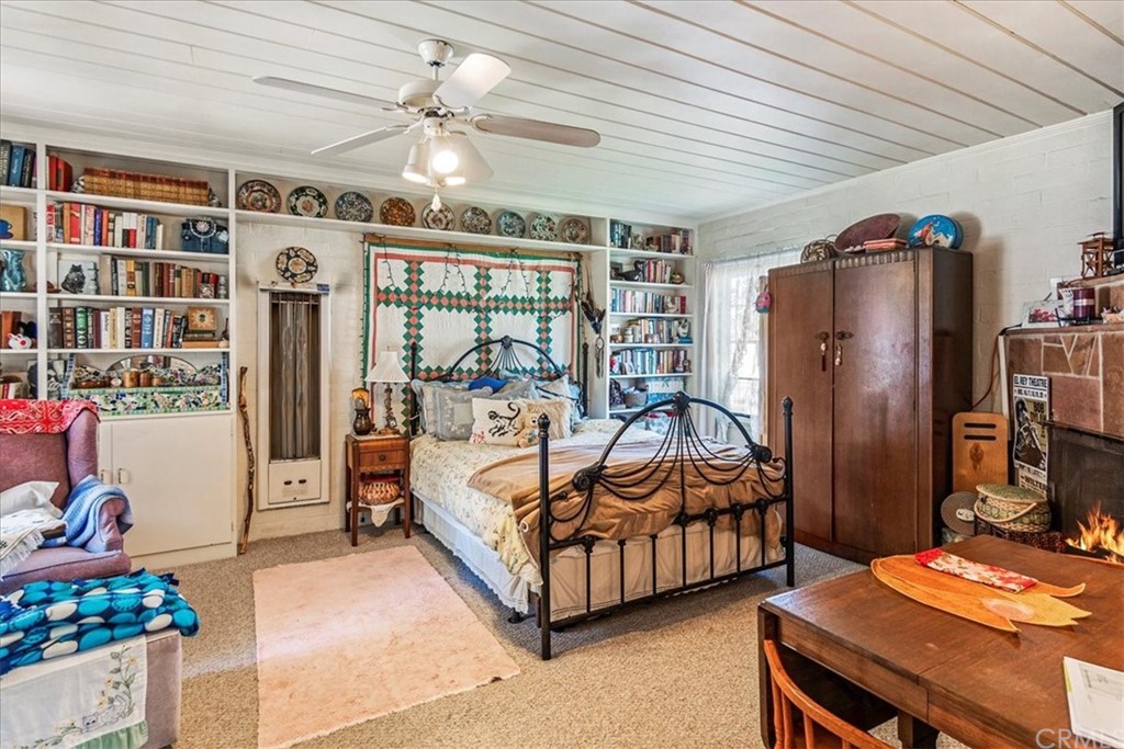 876 North 1st Avenue Upland, CA 91786 - Photo 14 of 30 a bedroom with bed and wooden floor