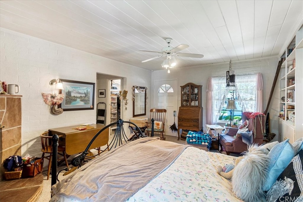 876 North 1st Avenue Upland, CA 91786 - Photo 15 of 30 a room with furniture a flat screen tv and a large window