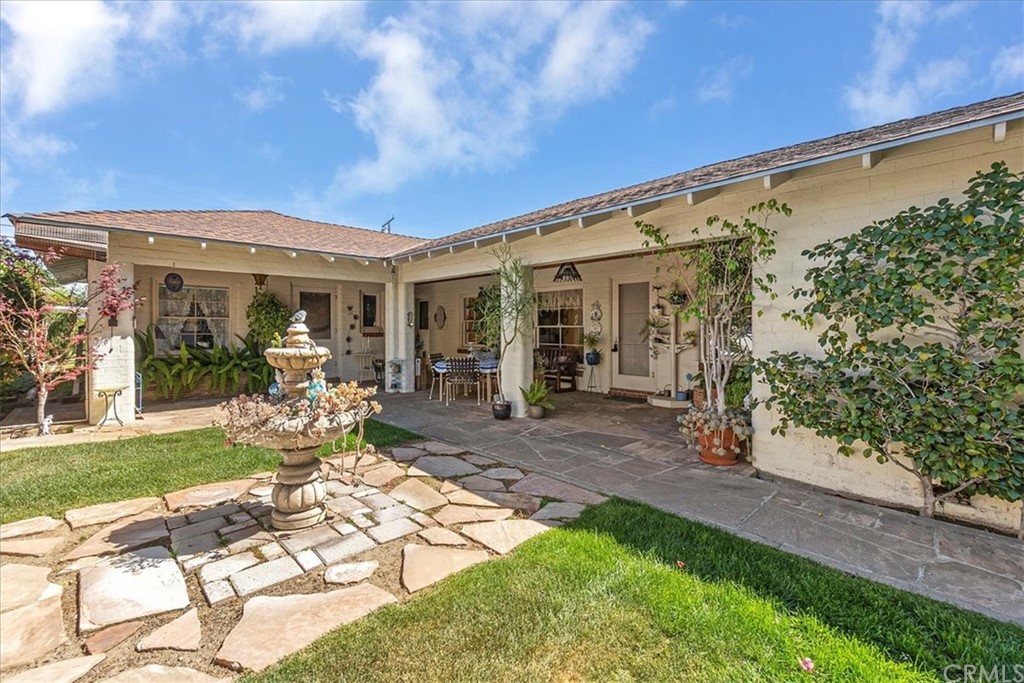 876 North 1st Avenue Upland, CA 91786 - Photo 21 of 30 a view of a patio with table and chairs and potted plants