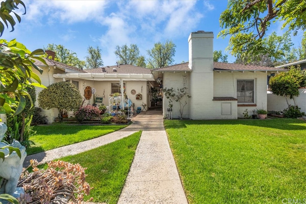 876 North 1st Avenue Upland, CA 91786 - Photo 23 of 30 a front view of house with yard and green space