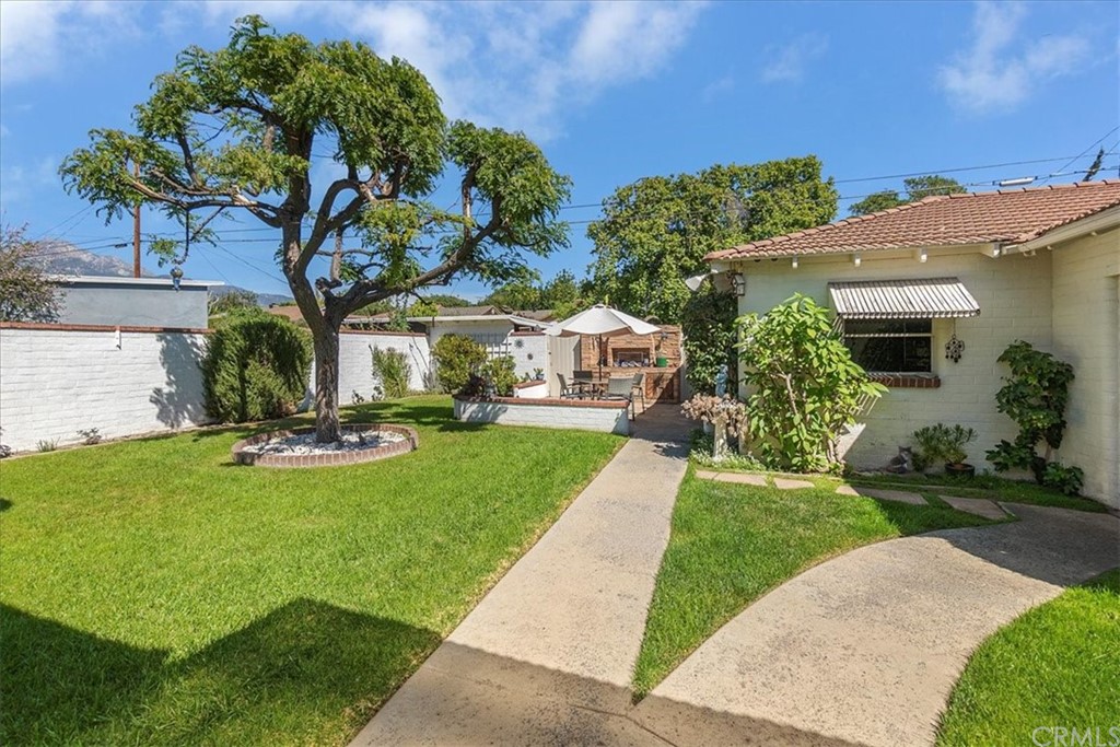 876 North 1st Avenue Upland, CA 91786 - Photo 24 of 30 a view of a house with garden and a tree