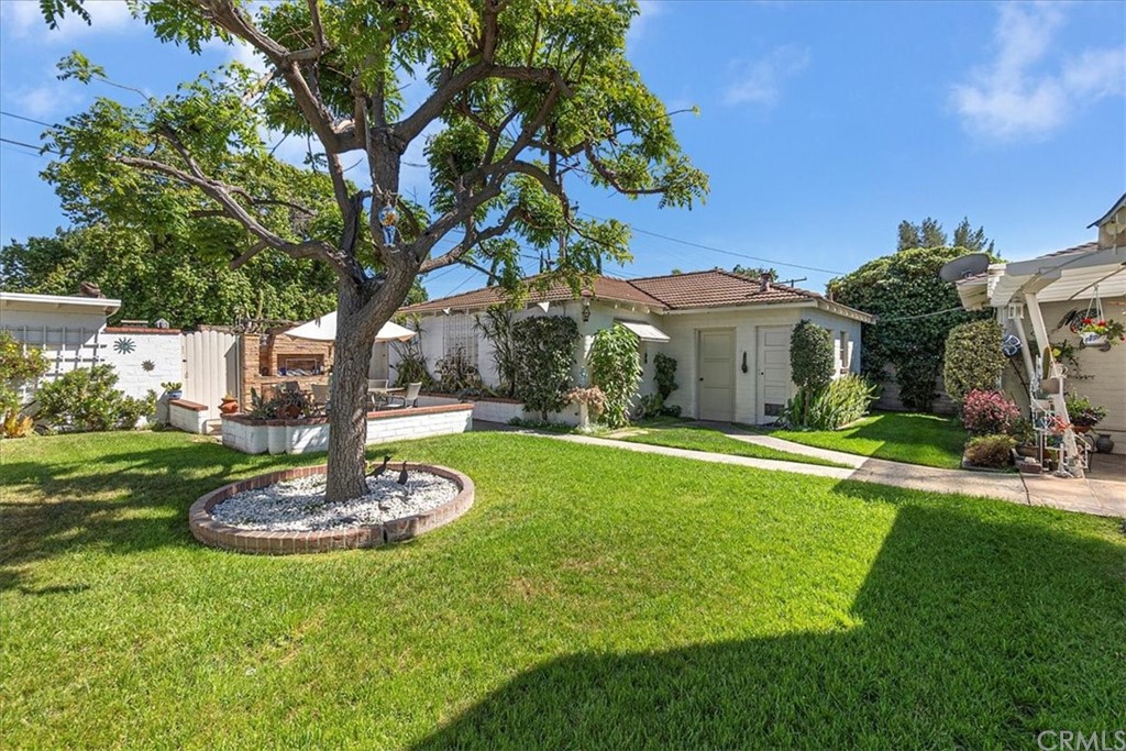 876 North 1st Avenue Upland, CA 91786 - Photo 25 of 30 a front view of a house with a yard