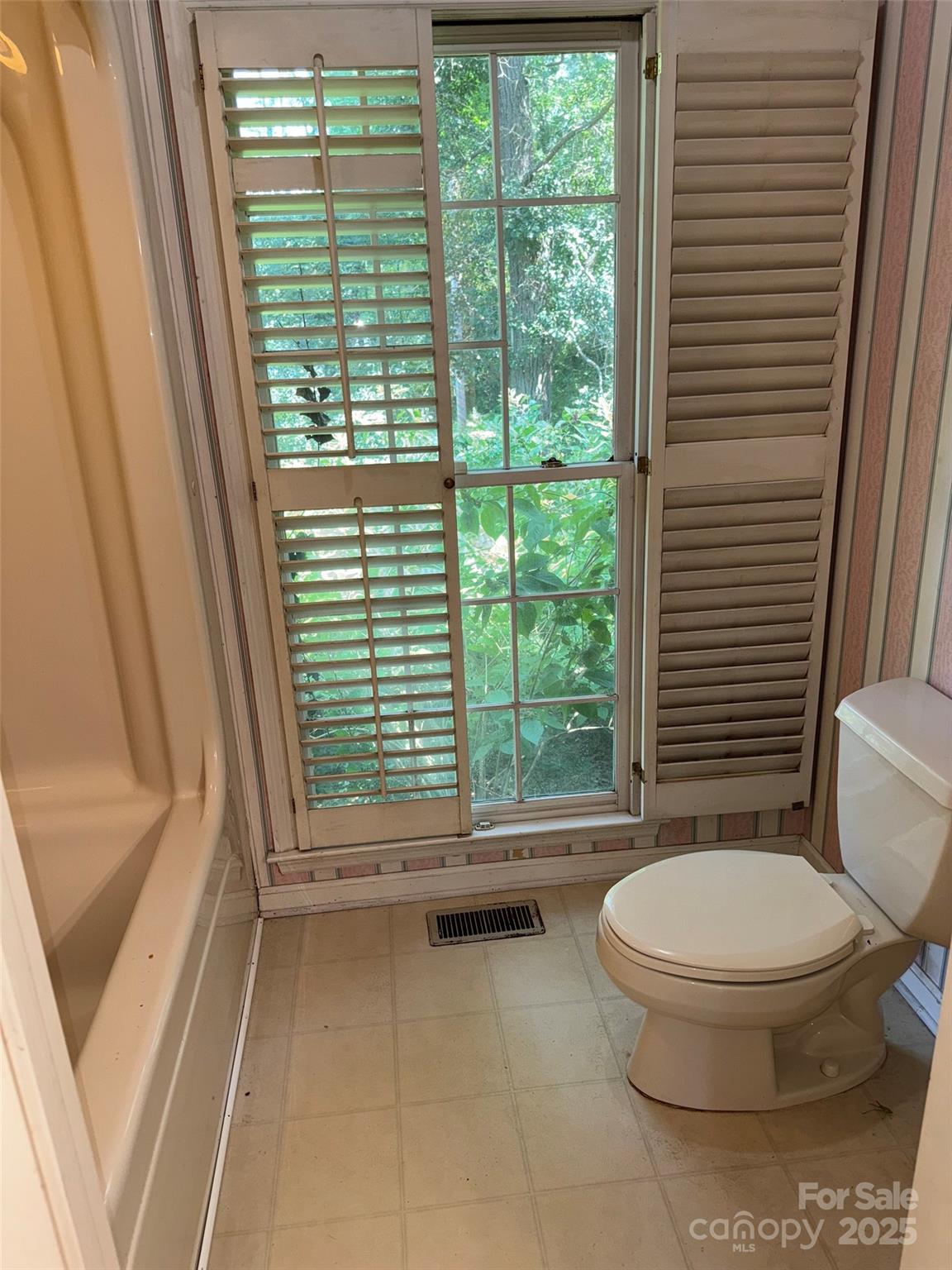 802 Roberdell Road Rockingham, NC 28379 - Photo 17 of 43 a bathroom with a toilet and a shower