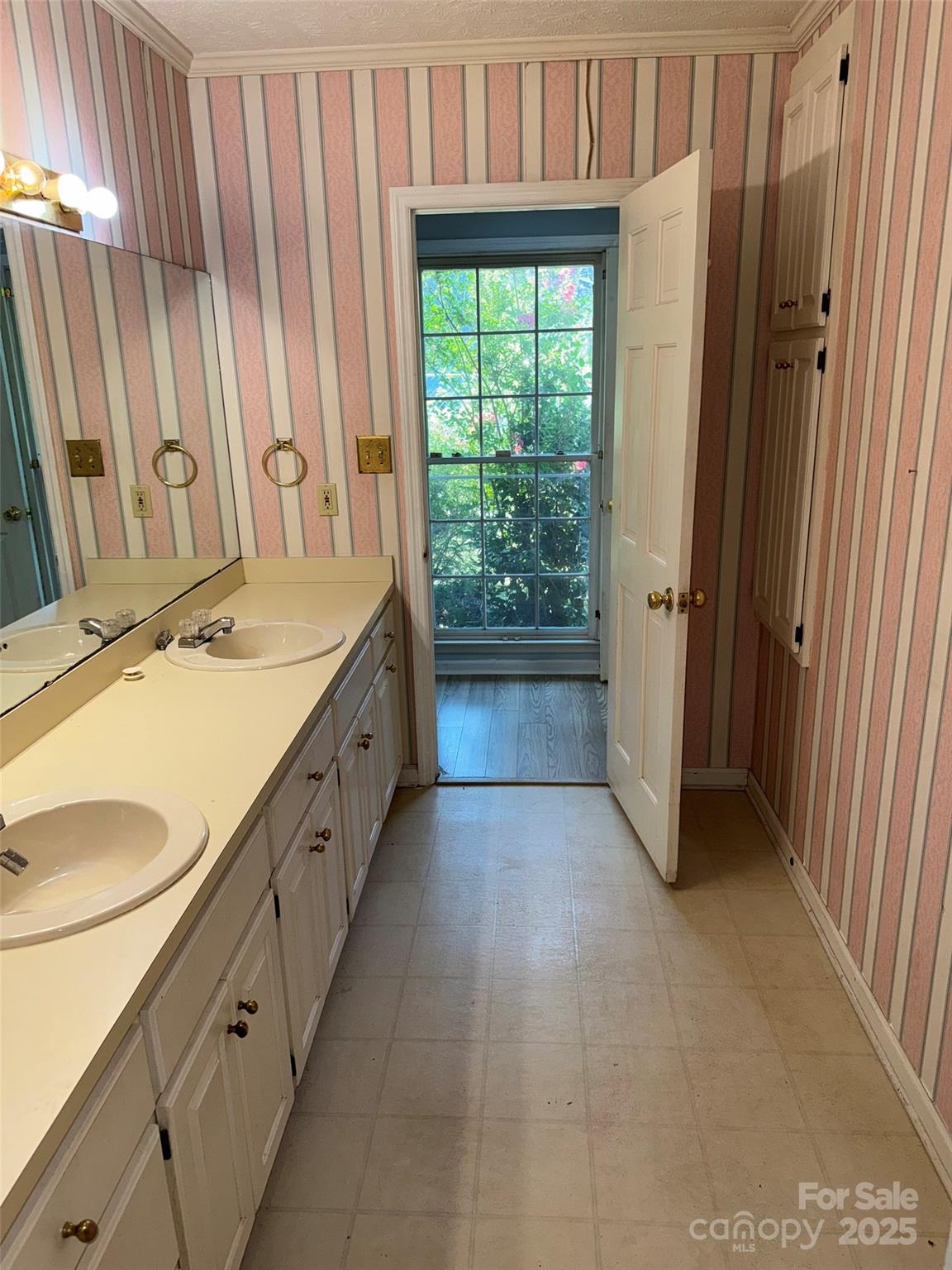 802 Roberdell Road Rockingham, NC 28379 - Photo 18 of 43 a bathroom with a granite countertop sink and a mirror next to a window