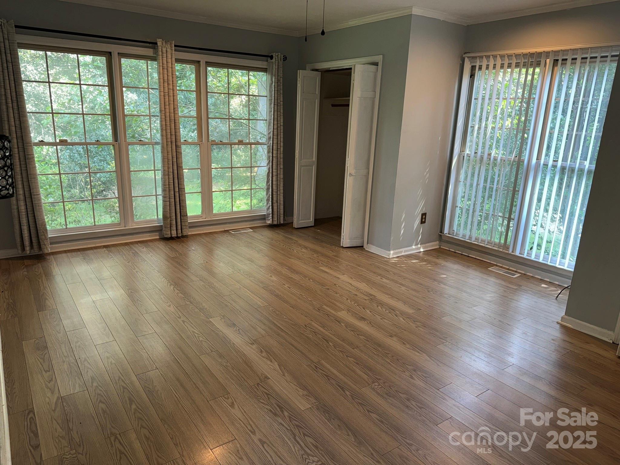 802 Roberdell Road Rockingham, NC 28379 - Photo 19 of 43 a view of a room with wooden floor and large window