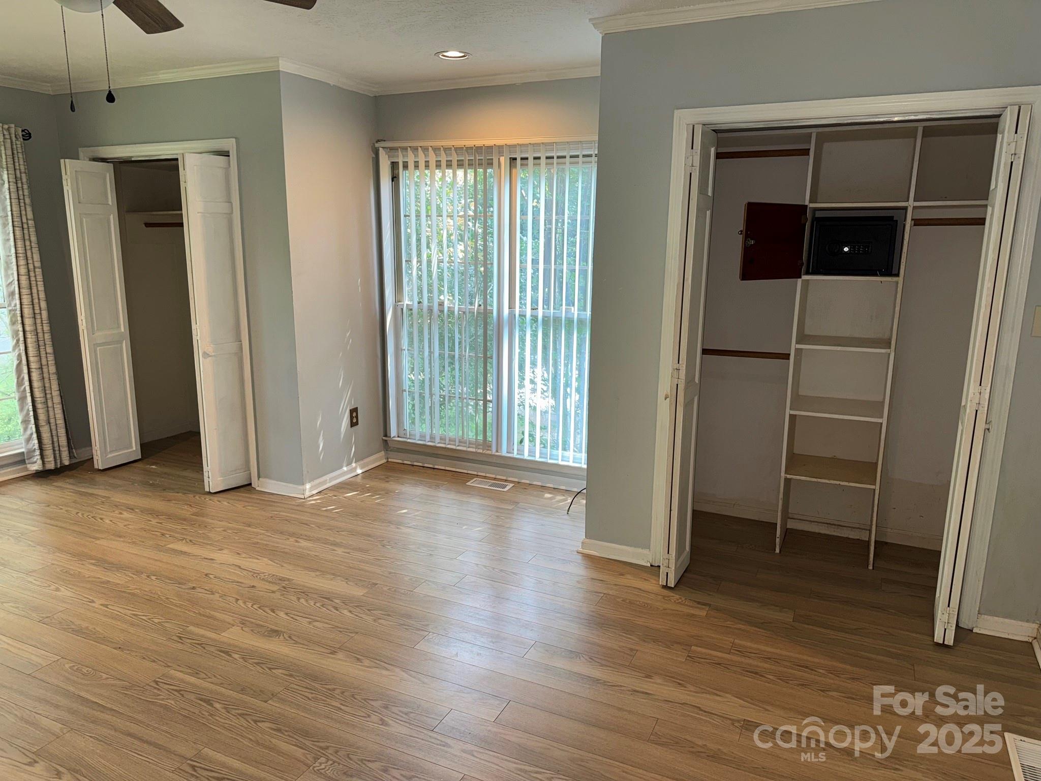 802 Roberdell Road Rockingham, NC 28379 - Photo 20 of 43 an empty room with wooden floor and a window