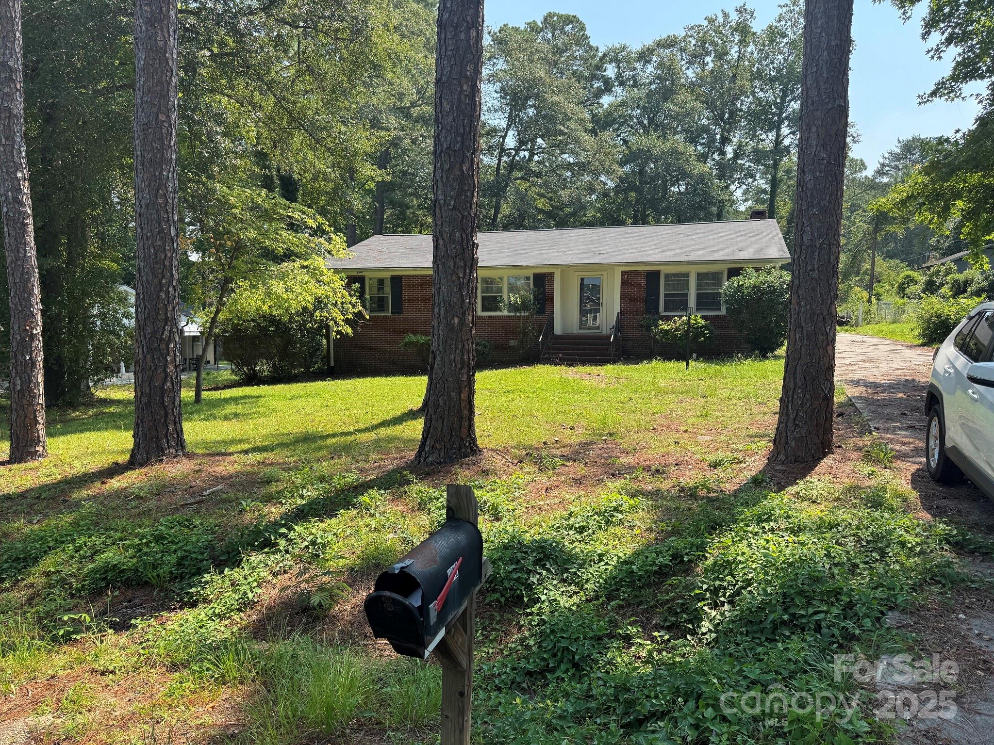 802 Roberdell Road Rockingham, NC 28379 - Photo 2 of 43 a view of a house with yard and tree s
