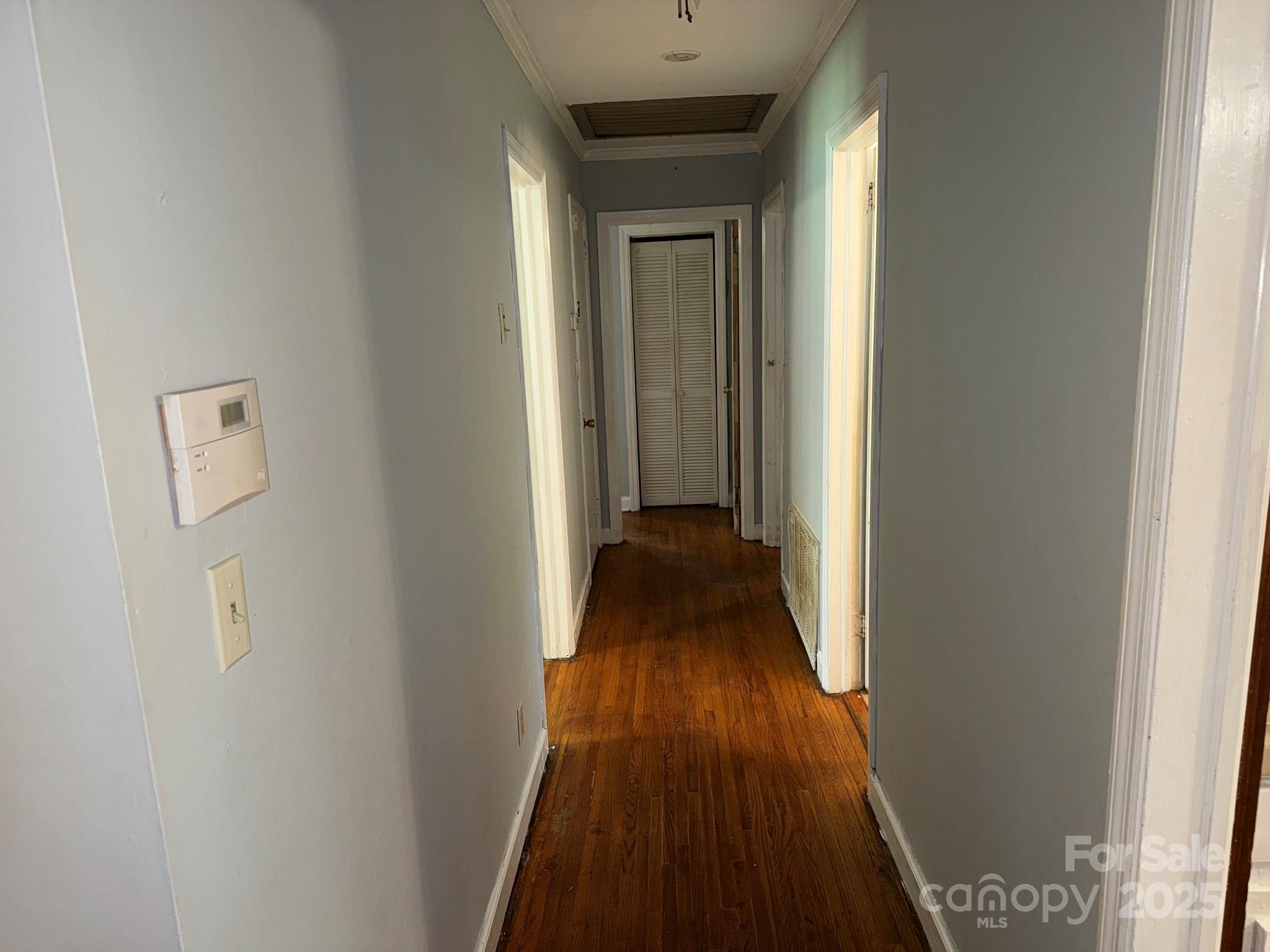 802 Roberdell Road Rockingham, NC 28379 - Photo 25 of 43 a view of a hallway with wooden floor