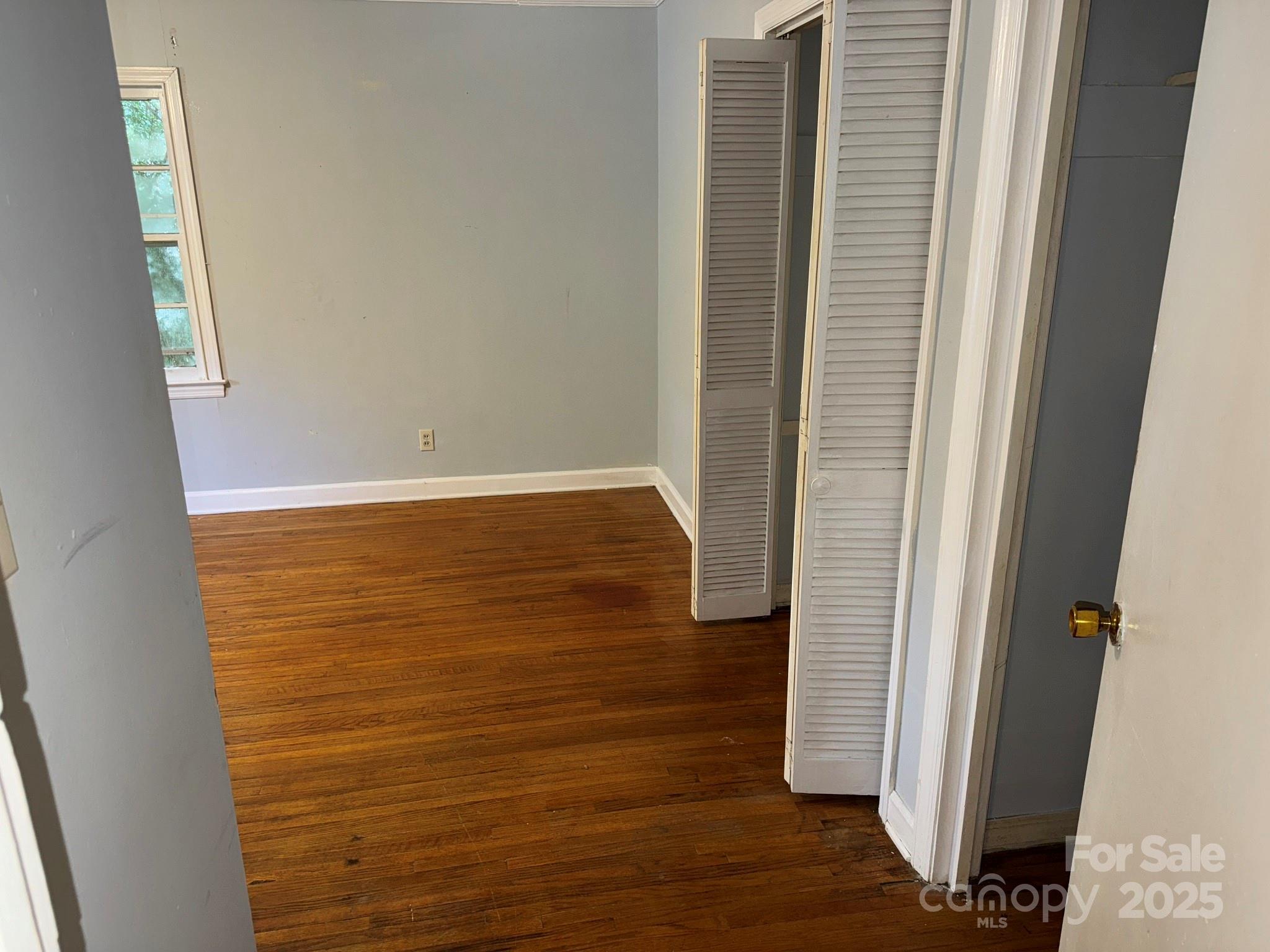 802 Roberdell Road Rockingham, NC 28379 - Photo 29 of 43 a view of walk in closet with wooden floor