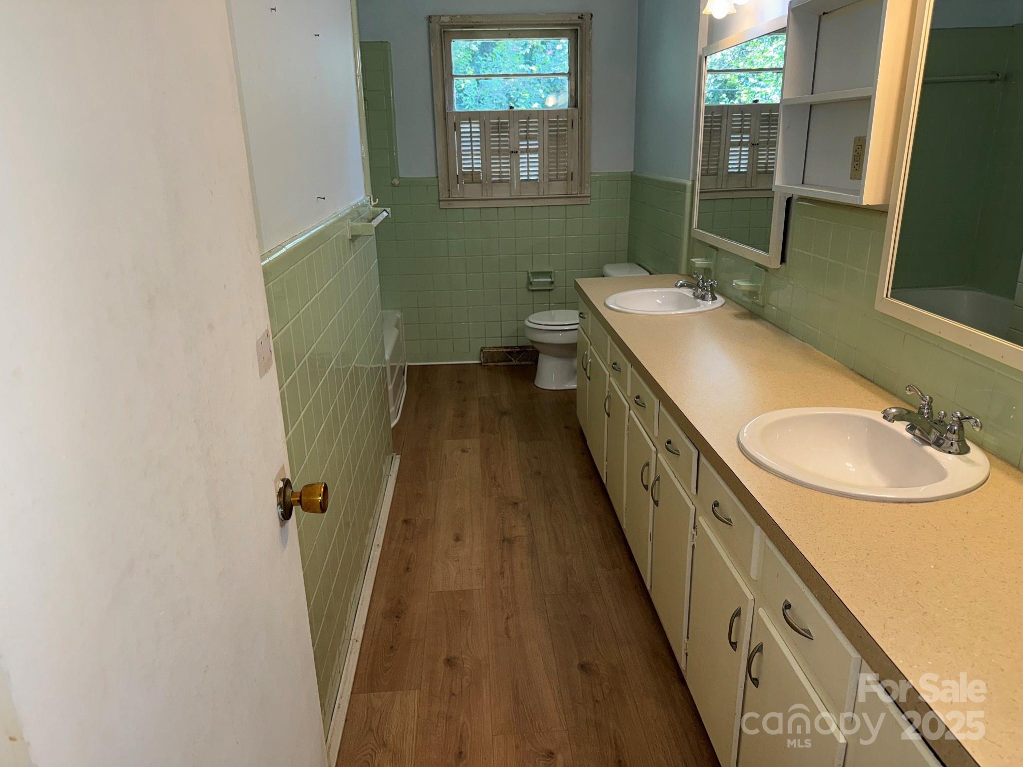 802 Roberdell Road Rockingham, NC 28379 - Photo 37 of 43 a bathroom with sink and mirror