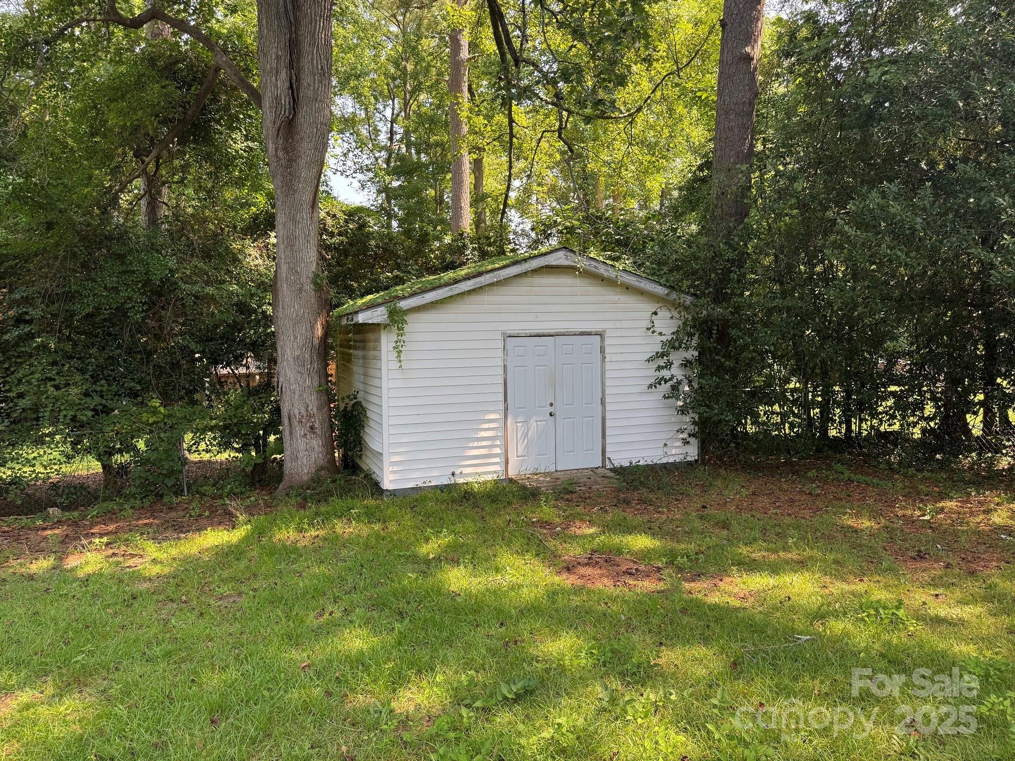 802 Roberdell Road Rockingham, NC 28379 - Photo 42 of 43 a view of backyard of house with green space