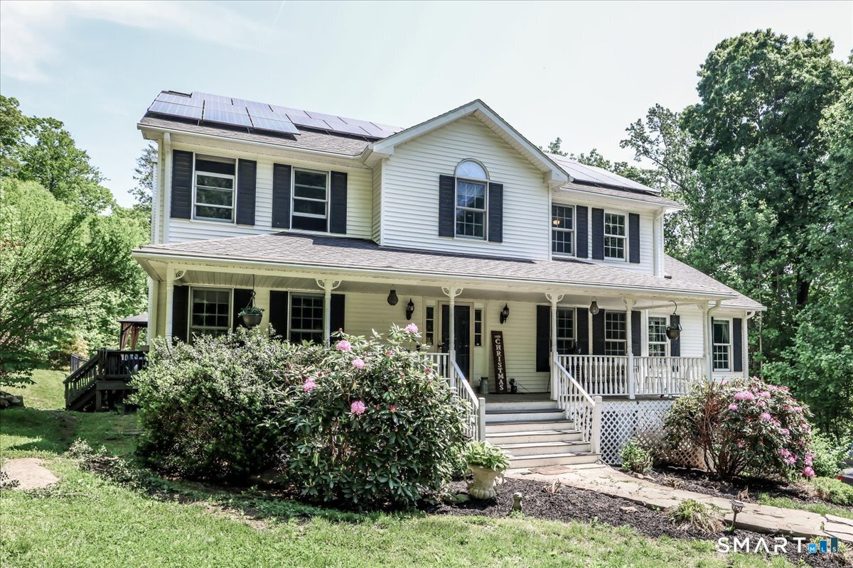 55 A Flax Hill Road Brookfield, CT 06804 - Photo 1 of 40 a front view of a house with a yard