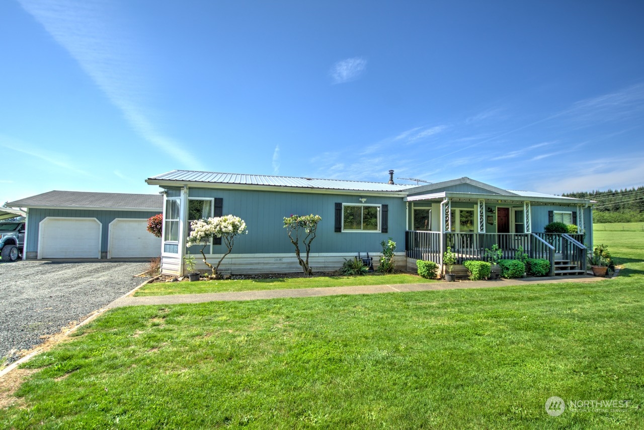 435 Jones Road Winlock, WA 98596 - Photo 1 of 30 a front view of a house with a yard and porch