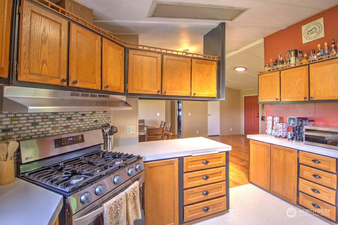 435 Jones Road Winlock, WA 98596 - Photo 15 of 30 a kitchen with stainless steel appliances a stove and a cabinets