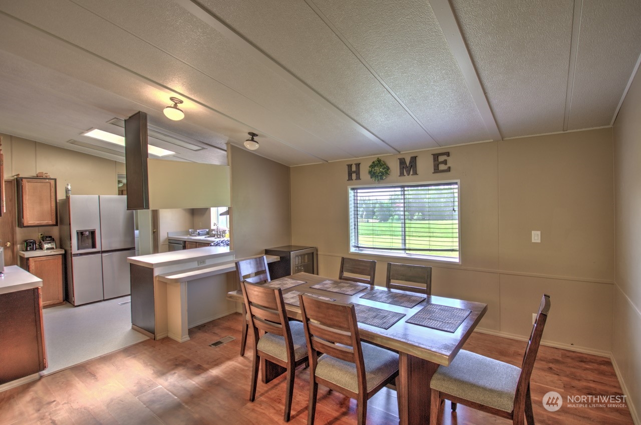 435 Jones Road Winlock, WA 98596 - Photo 18 of 30 a view of a dining room with furniture window and wooden floor