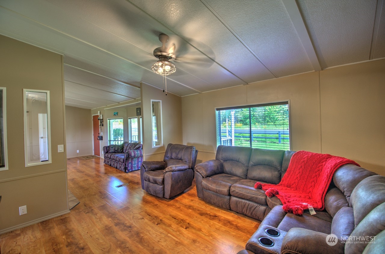 435 Jones Road Winlock, WA 98596 - Photo 24 of 30 a living room with furniture ceiling fan and a window