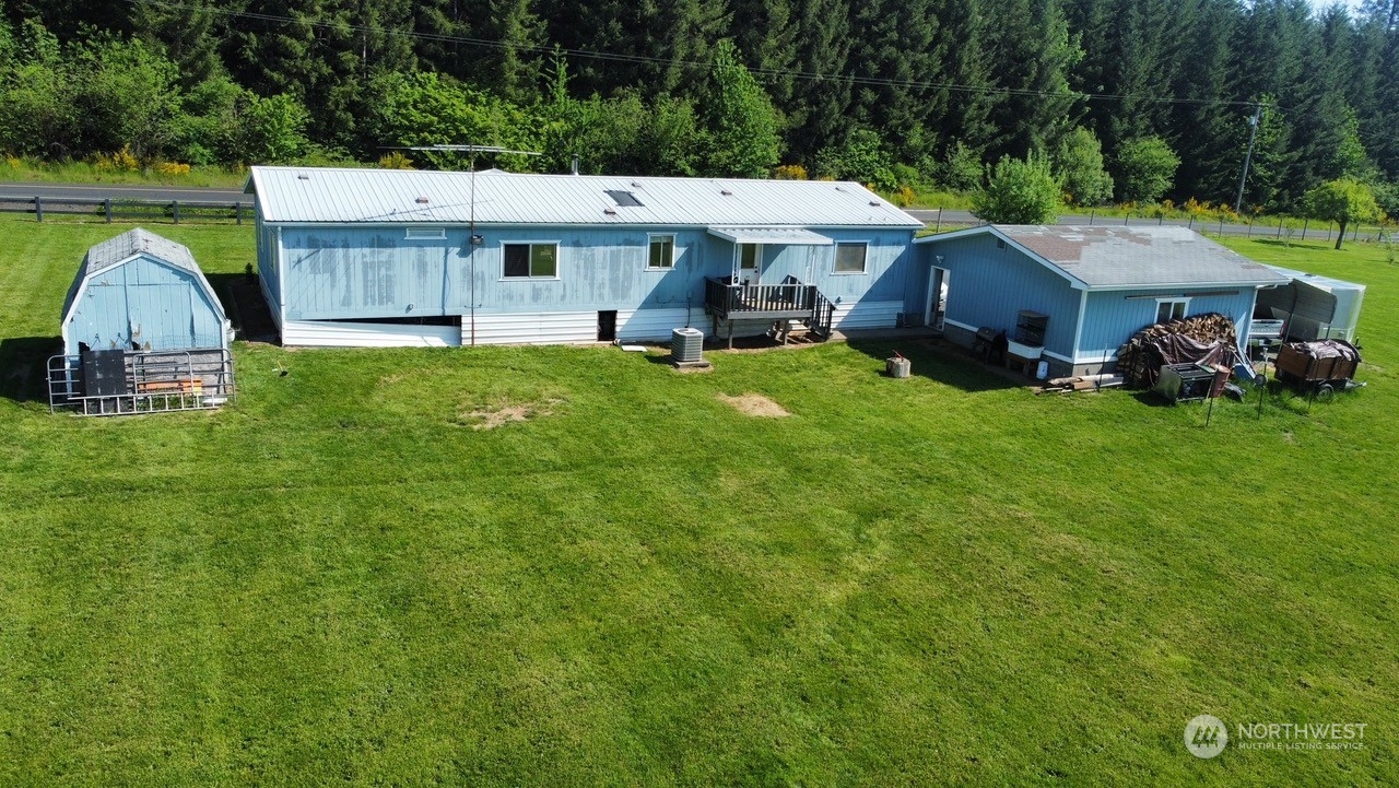 435 Jones Road Winlock, WA 98596 - Photo 30 of 30 swimming pool view with a seating space and a garden
