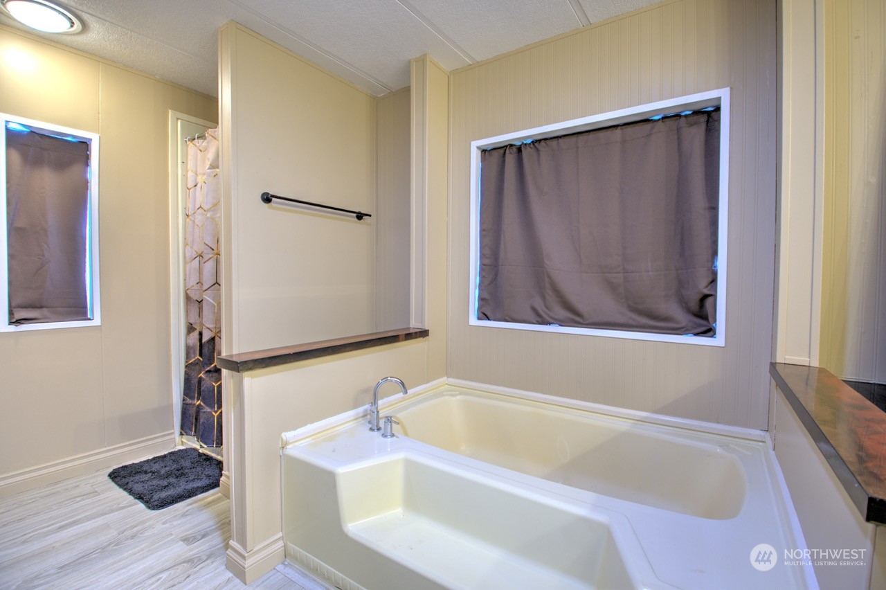 435 Jones Road Winlock, WA 98596 - Photo 8 of 30 a bathroom with a tub and shower