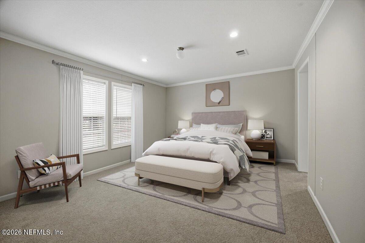 6067 Taft Road Macclenny, FL 32063 - Photo 11 of 23 a bedroom with a bed and a couch