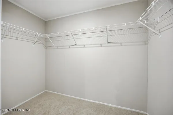 a view of a room with racks on the wall
