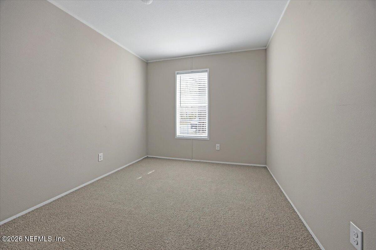 6067 Taft Road Macclenny, FL 32063 - Photo 17 of 23 an empty room with a window