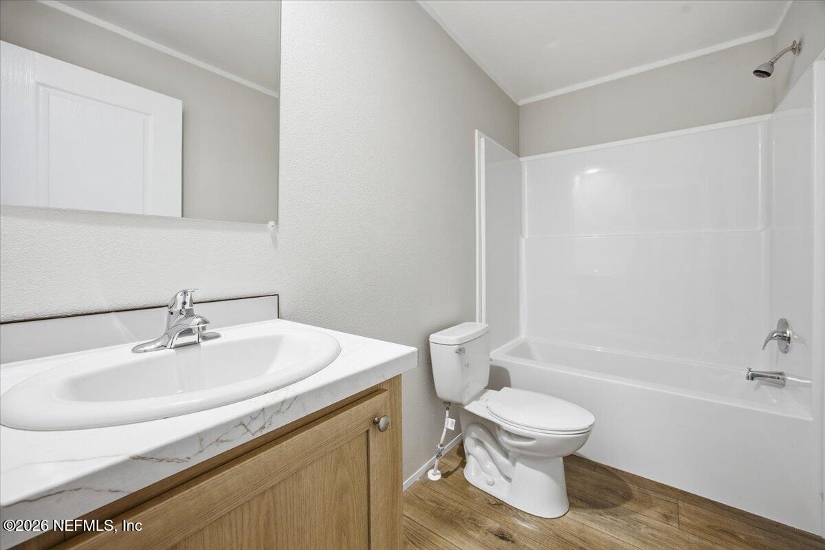 6067 Taft Road Macclenny, FL 32063 - Photo 20 of 23 a bathroom with a sink toilet and a bathtub